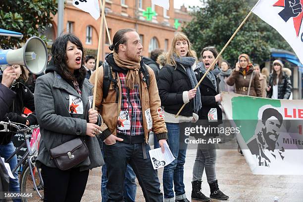 People take part in a protest to support Georges Ibrahim Abdallah, a pro-palestinian militant, in Toulouse, southwestern France, on January 26, 2013....