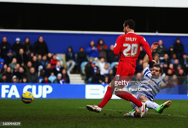 Ryan Harley of Milton Keynes Dons skips the challenge of Tal Ben Haim of Queens Park Rangers and scores his sides third goal during the FA Cup with...