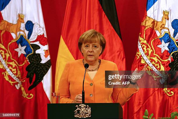 German Chancellor Angela Merkel speaks during a ceremony with Chilean President Sebastian Pinera at La Moneda presidential palace in Santiago as part...