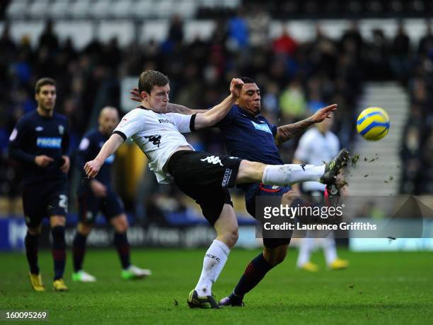 Colin Kazim-Richards of Blackburn Rovers battles with Mark O'Brien of Derby County during the FA Cup with Budweiser Fourth Round match between Derby...