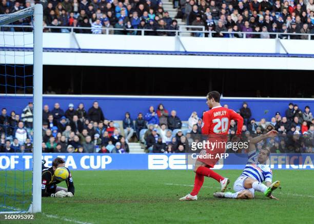 Dons' Ryan Harley scores against Queens Park Rangers during the FA Cup fourth round football match between QPR and MK Dons at Loftus Road in London...