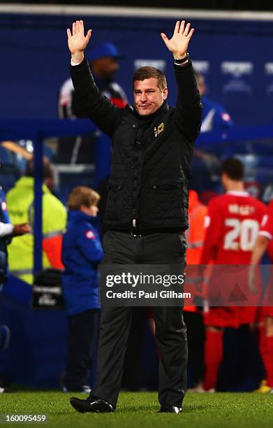 Karl Robinson the Milton Keynes Dons manager salutes his sides fans following their victory during the FA Cup with Budweiser Fourth Round match...