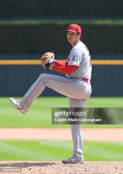 Shohei Ohtani of the Los Angeles Angels throws a warm-up pitch at the start of the 8th inning of game one of a doubleheader against the Detroit...