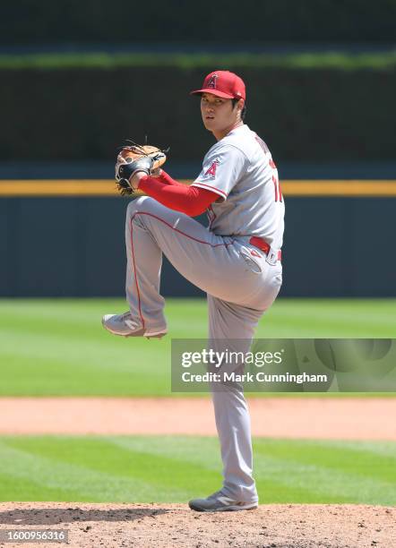 Shohei Ohtani of the Los Angeles Angels throws a warm-up pitch at the start of the 8th inning of game one of a doubleheader against the Detroit...