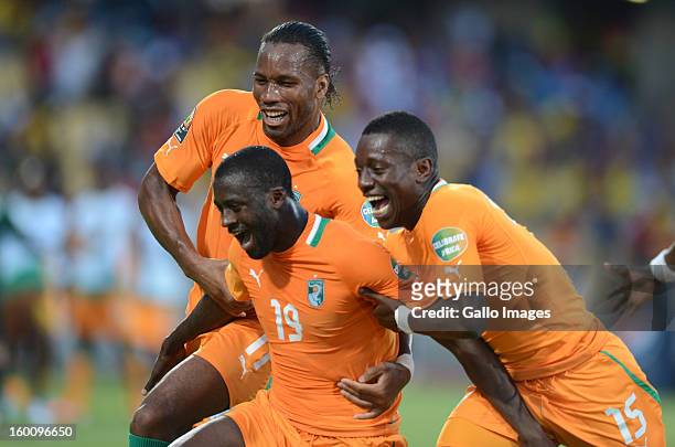 Yaya Toure of Ivory Coast celebrates scoring a goal with Didier Drogba and Max Gradel during the 2013 African Cup of Nations match between Ivory...