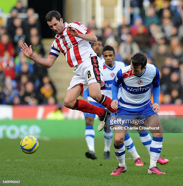 Michael Doyle of Sheffield United puts in a high tackle on Reading's Adam Le Fondre during the FA Cup Fourth Round match between Reading and...