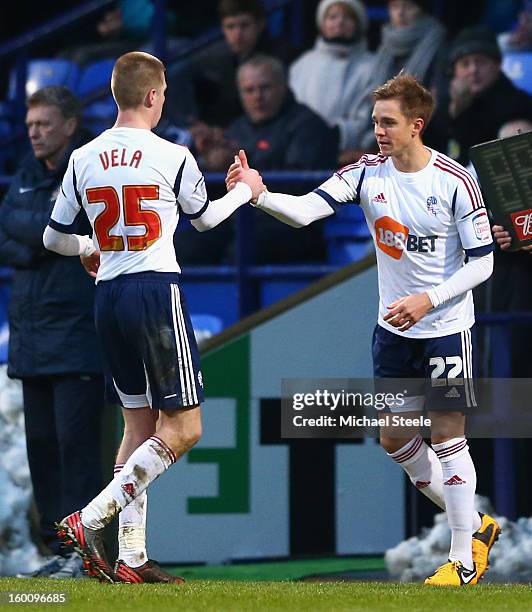 Stuart Holden of Bolton Wanderers come on for team mate Joshua Vela during the FA Cup with Budweiser Fourth Round match between Bolton Wanderers and...