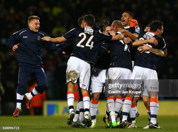 Luton Town players celebrate the win at the final whistle during the FA Cup with Budweiser fourth round match between Norwich City and Luton Town at...