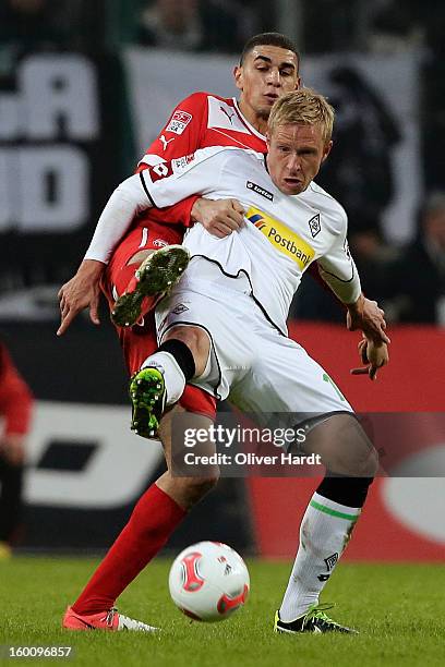 Mike Hanke of Gladbach and Leon Balogun of Duesseldorf battle for the ball during at Bundesliga match between VfL Borussia Moenchengladbach v Fortuna...