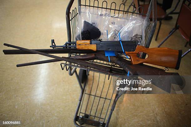 Some of the weapons turned in to the City of Miami police are seen during a gun buy back event on January 26, 2013 in Miami, Florida. The event was...