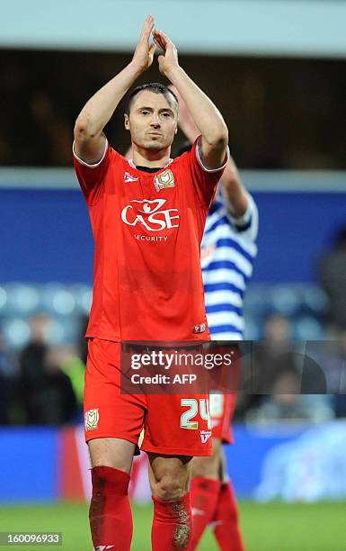 Dons player Antony Kay celebrates winning 4-2 against Queens Park Rangers during the FA Cup fourth round football match between QPR and MK Dons at...