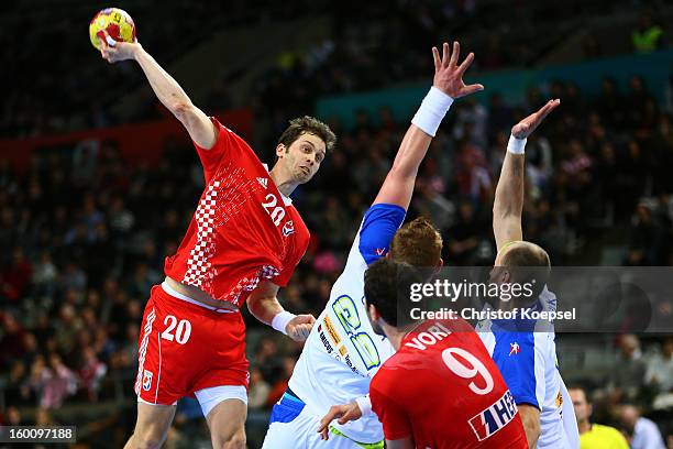 Matej Gaber and Vid Kavticnik of Slovenia defend against Damir Bicanic of Croatia during the Men's Handball World Championship 2013 third place match...