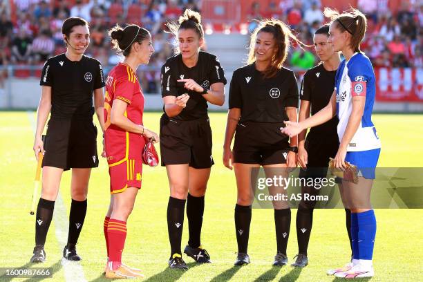 Captains Claudia Ciccotti of AS Roma and Ainhoa Moraza of Atletico de Madrid decide pitch side after the open ceremony coin toss prior to start the...