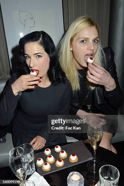 Dita Von Teese and Andreas Pejic attend the 'Body Double' Ali Mahdavi Exhibition Preview Cocktail At Hotel W on January 25, 2013 in Paris, France.