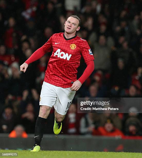 Wayne Rooney of Manchester United celebrates scoring their second goal during the FA Cup Fourth Round match between Manchester United and Fulham at...