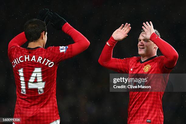 Wayne Rooney of Manchester United celebrates scoring his team's second goal with team-mate Javier Hernandez during the FA Cup with Budweiser Fourth...