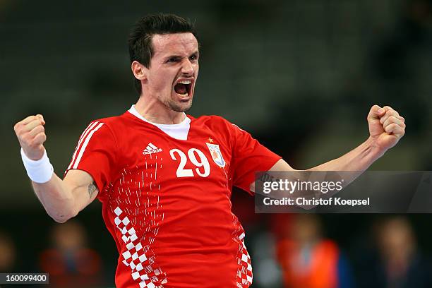 Ivan Nincevic of Croatia celebrates a goal during the Men's Handball World Championship 2013 third place match between Slovenia and Croatia at Palau...