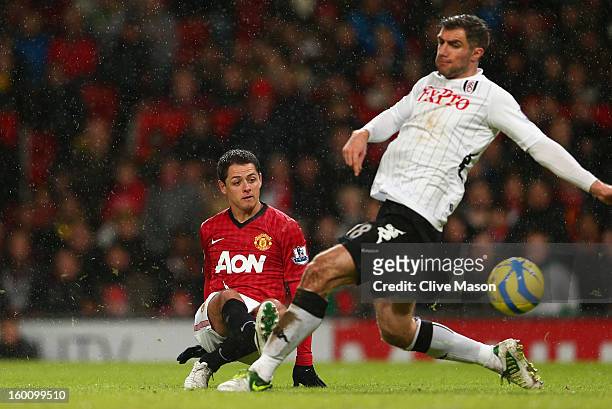 Aaron Hughes of Fulham is unable to stop Javier Hernandez of Manchester United scoring his team's fourth goal during the FA Cup with Budweiser Fourth...
