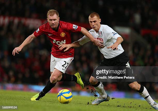 Paul Scholes of Manchester United in action with Steve Sidwell of Fulham during the FA Cup Fourth Round match between Manchester United and Fulham at...