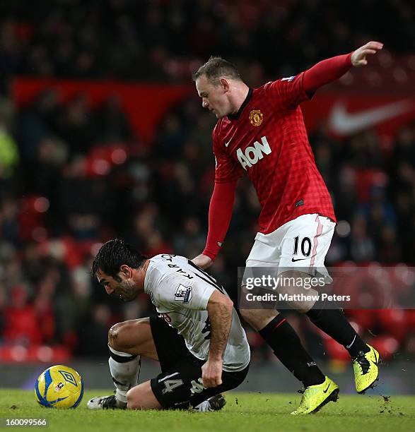 Wayne Rooney of Manchester United in action with Giorgios Karagounis of Fulham during the FA Cup Fourth Round match between Manchester United and...