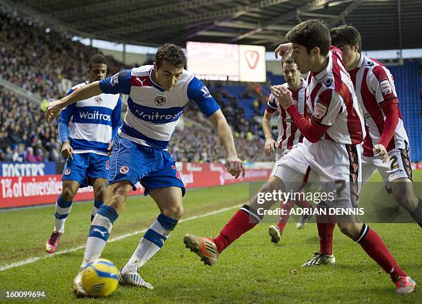 Reading's Stephen Kelly vies for the ball against Sheffield United's Ryan Flynn during the FA Cup fourth round football match between Reading and...