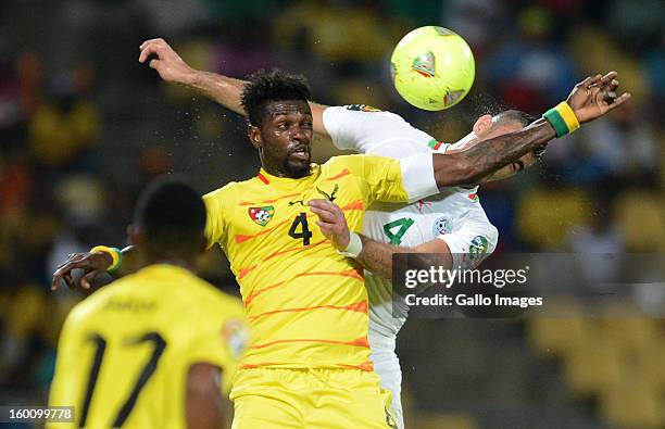 Emmanuel Adebayor of Togo is challenge by Essaid Belkalem of Algeria during the 2013 African Cup of Nations match between Togo and Algeria at Royal...