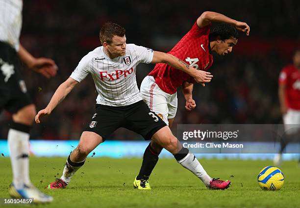 John Arne Riise of Fulham tangles with Rafael of Manchester United during the FA Cup with Budweiser Fourth Round match between Manchester United and...