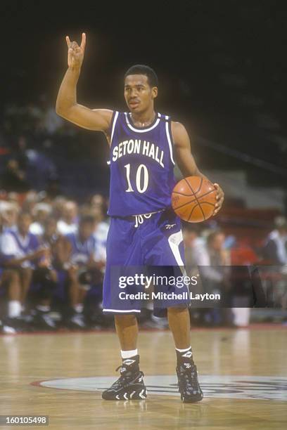 Shaheen Holloway of the Seton Hall Pirates dribbles the ball during a college basketball game against the Georgetown Hoyas on January 6, 1998 at MCI...