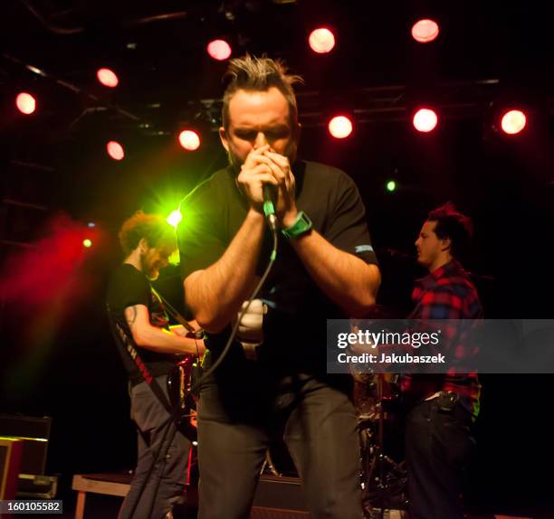 Chad Urmston, Pete Francis Heimbold and Brad Corrigan of the US band Dispatch perform live during a concert at the Postbahnhof on January 26, 2013 in...