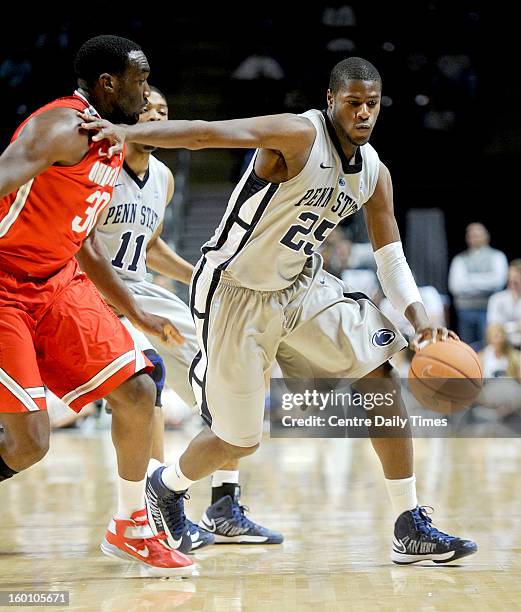 Penn State's Jon Graham works off the dribble against Ohio State's Evan Ravenel on Saturday, January 26 at the Bryce Jordan Center in University...