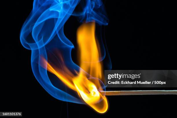 close-up of fire against black background - arson - fotografias e filmes do acervo