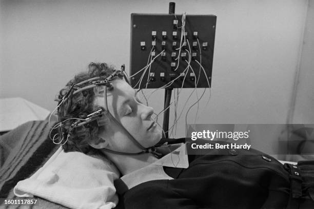 Young woman with epilepsy is examined in a medical laboratory, circa 1951. Original Publication: Picture Post - 5256 - Epileptic Children - unpub.