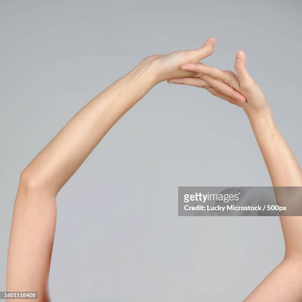 cropped hands of woman gesturing against gray background,california,united states,usa - granuloma annulare stock pictures, royalty-free photos & images