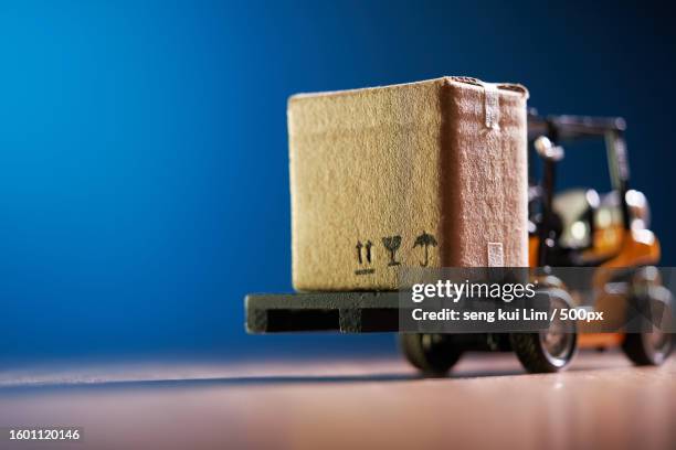 close-up of toy blocks on table against blue background - cassetta degli attrezzi foto e immagini stock