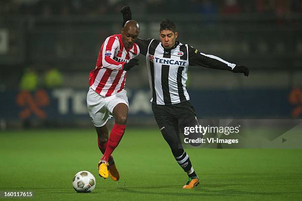 Atiba Hutchinson of PSV, Everton Ramos da Silva of Heracles Almelo during the Dutch Eredivise match between Heracles Almelo and PSV Eindhoven at the...