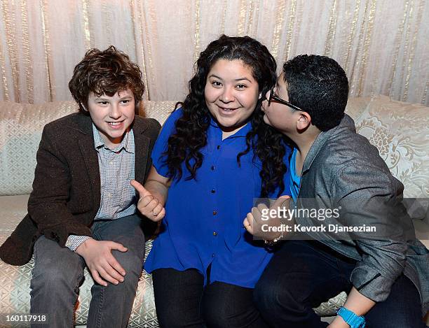 Actors Nolan Gould Raini Rodriguez and her brother Rico Rodriguez in the green room during the 19th Annual Screen Actors Guild Awards red carpet roll...