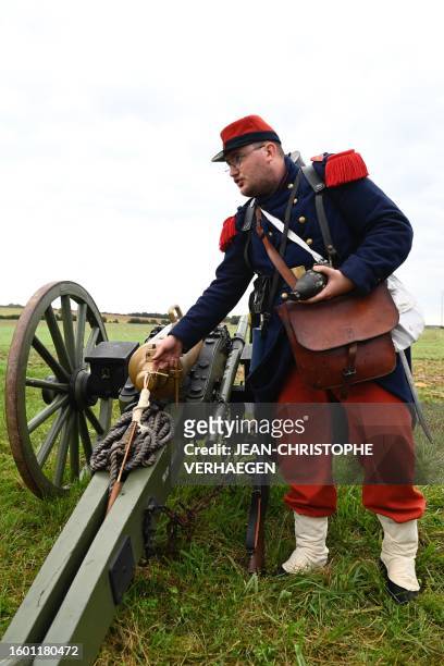 Re-enactor, in period costume of French soldiers of 2nd Regiment of Line Infantry, gives explanations during the re-enact the 1870 war and the...