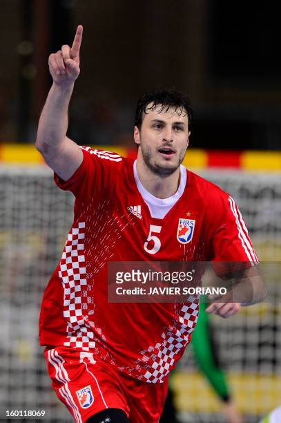 Croatia's centre back Domagoj Duvnjak celebrates after scoring during the 23rd Men's Handball World Championships bronze medal match Slovenia vs...