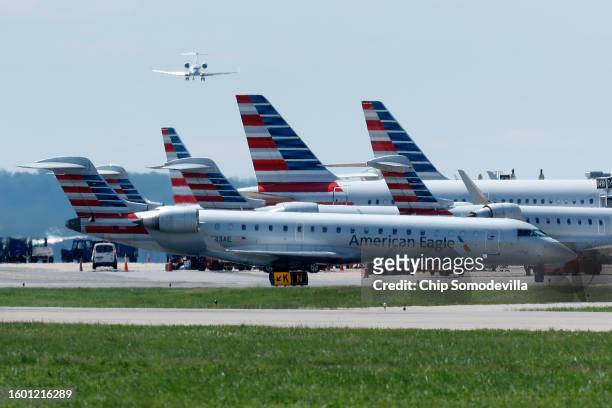 American Airlines passenger planes are parked at the gates of Terminal 2 at Ronald Reagan Washington National Airport on August 08, 2023 in...