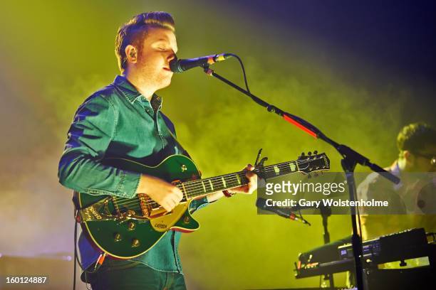 Alex Trimble of Two Door Cinema Club performs on stage at Manchester Apollo on January 26, 2013 in Manchester, England.