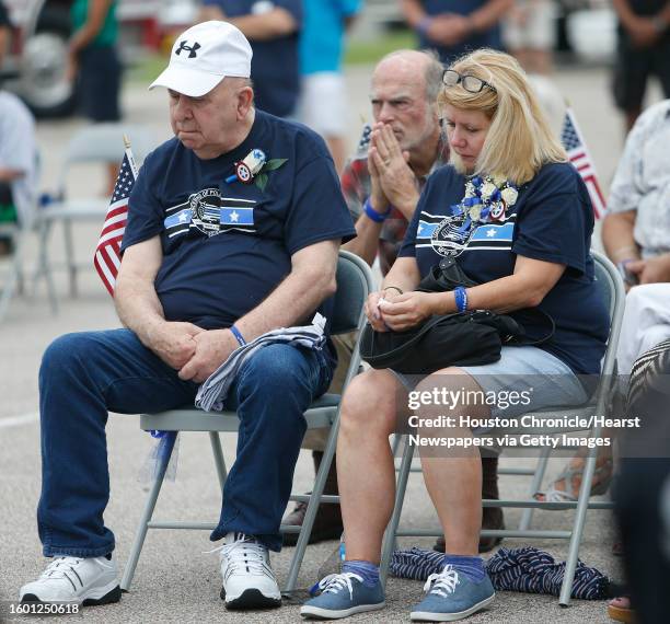 Allen Goforth and his daughter Debbie Ferguson listen during the one-year anniversary memorial for slain Harris County Deputy Darren Goforth at a...