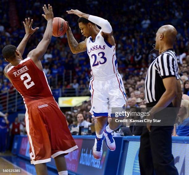 Kansas' Ben McLemore plays a ball along the sidelines against Oklahoma's Steven Pledger in the first half at Allen Fieldhouse in Lawrence, Kansas, on...