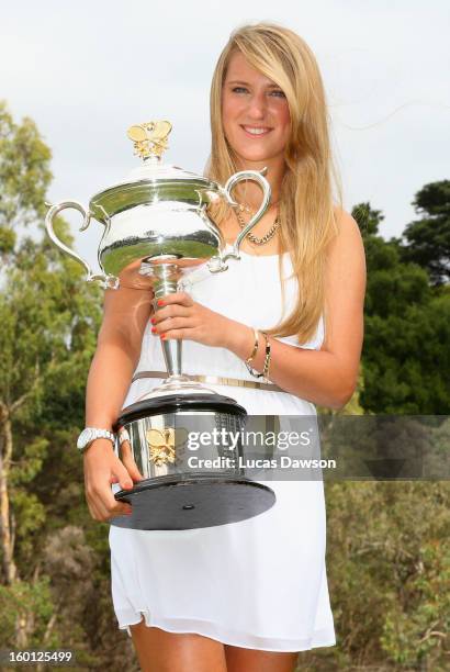 Victoria Azarenka of Belarus poses with the Daphne Akhurst Memorial Cup at The Royal Botanic Gardens, after winning the 2013 Australian Open, on...
