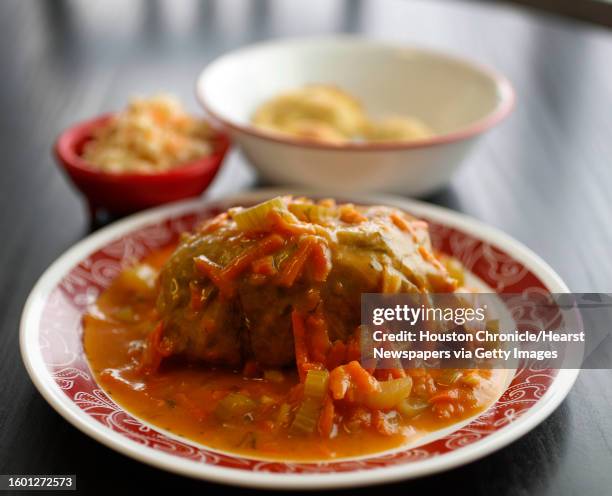 The Stuffed Cabbage with tomato sauce with fried pierogis and coleslaw at the Pierogi Queen, a Polish restaurant in League City, Thursday, January 5,...