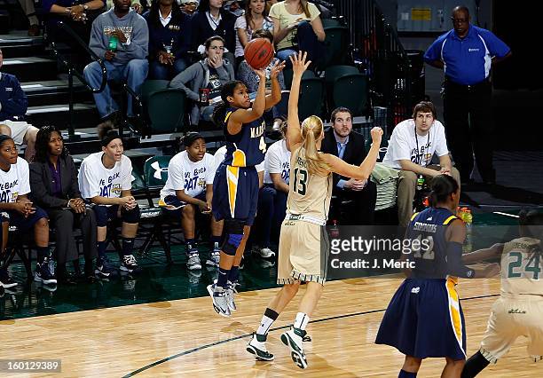 Arlesia Morse of the Marquette Golden Eagles shoots over Inga Orekhova of the South Florida Bulls defends during the game at the Sun Dome on January...