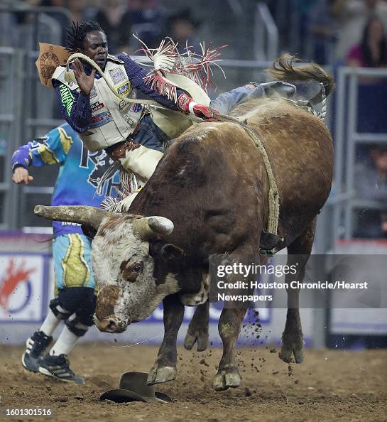 Nathan Helm Ranch Bull Riding Neil Holmes, of Cleveland, Texas, rides Live Action the bull during ...