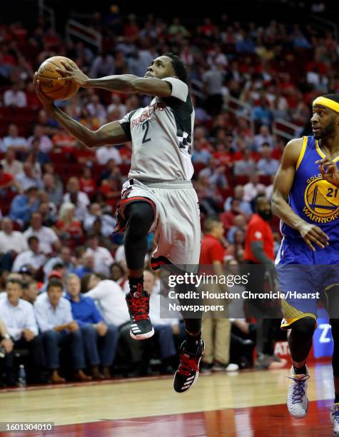 Houston Rockets guard Patrick Beverley goes up for a basket against Golden State Warriors guard Ian Clark during the first half of an NBA basketball...