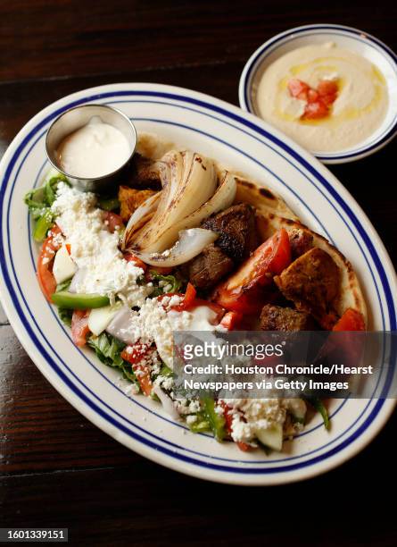 Kabob Plate with chicken breast and certified angus beef with a side of hummus at the new Island Grill, at 2365A Rice Blvd, in Rice Village, Monday,...