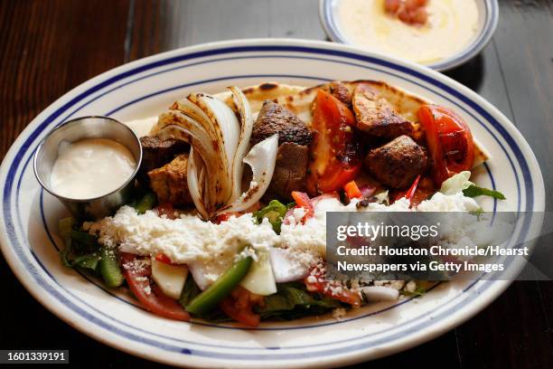 Kabob Plate with chicken breast and certified angus beef with a side of hummus at the new Island Grill, at 2365A Rice Blvd, in Rice Village, Monday,...