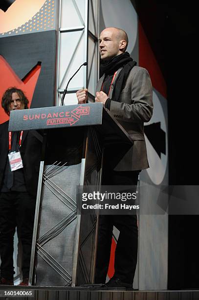 Richard Rowley accepts the Winner of the Cinematography Award: U.S. Documentary for Dirty Wars onstage at the Awards Night Ceremony during the 2013...